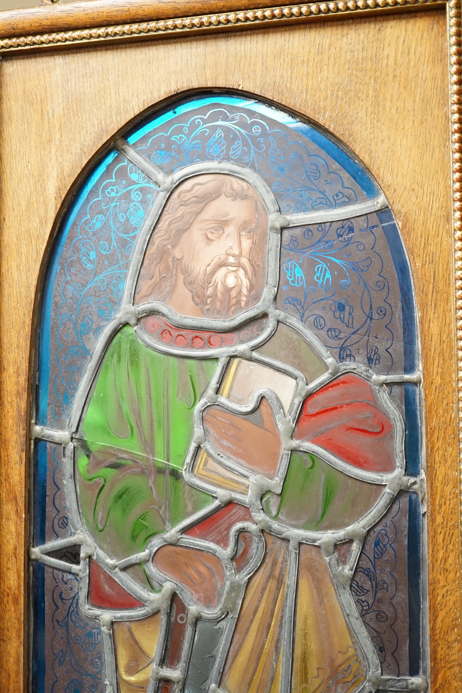 A pair of Victorian framed stained glass panels of St. Martin and St. Simon. 68.5cm tall